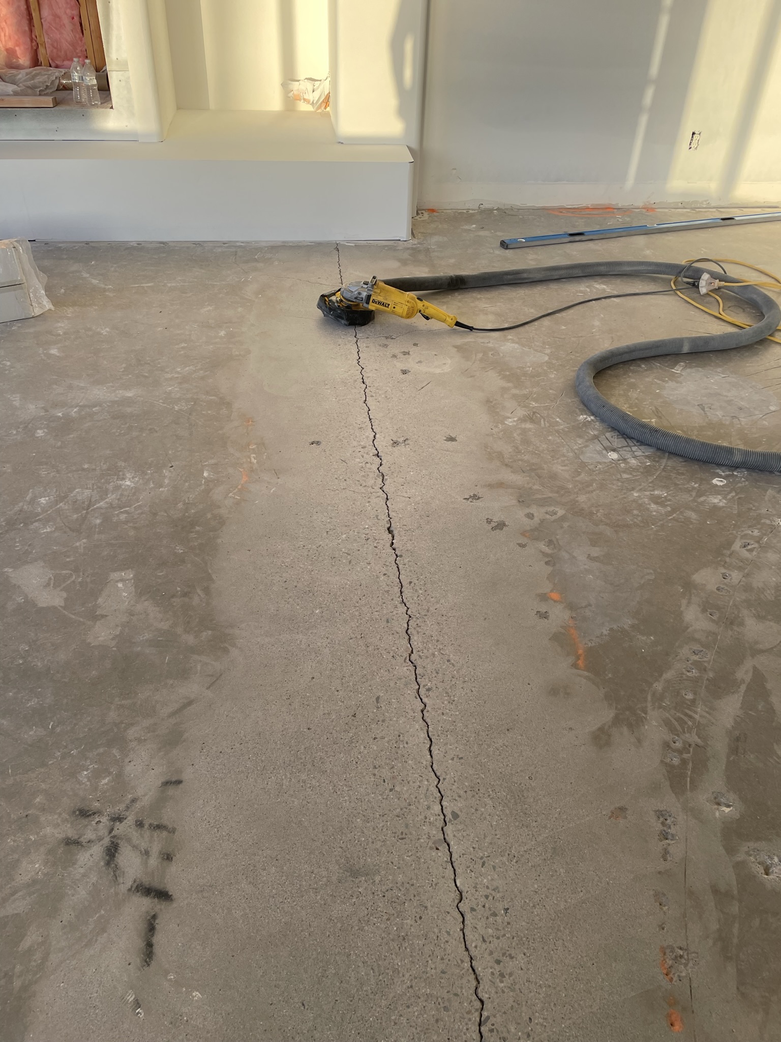 Smoothing out expansion crack after Dustless Tile Removal.