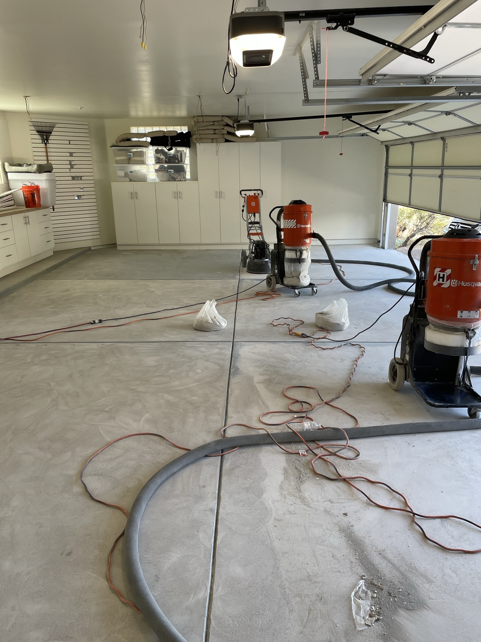 Grinding old epoxy, prepping the garage for new install.