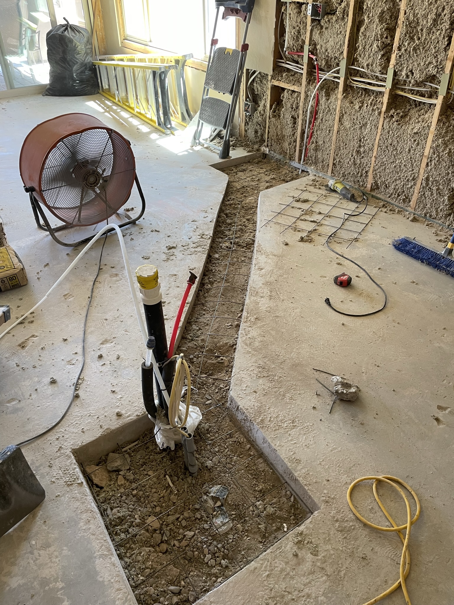 Cut channel in kitchen for island relocation.