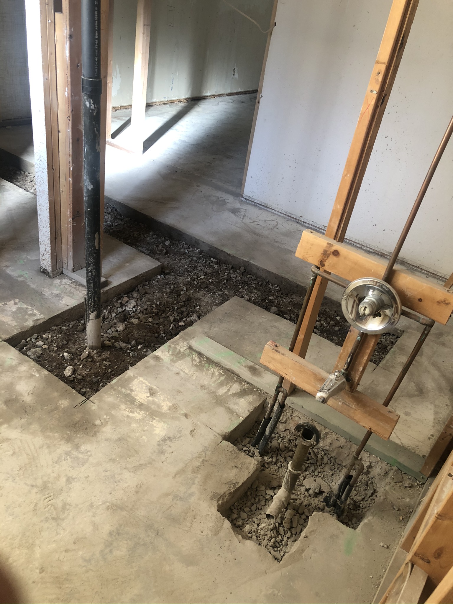 Cement cuts for plumbing relocation.