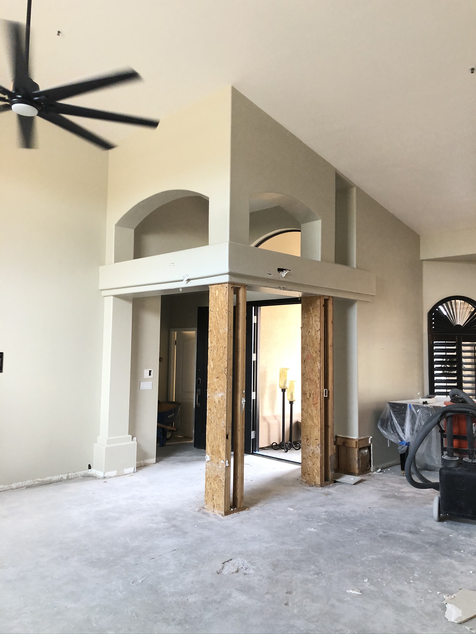 Before demolition of non load-bearing entry pillars.