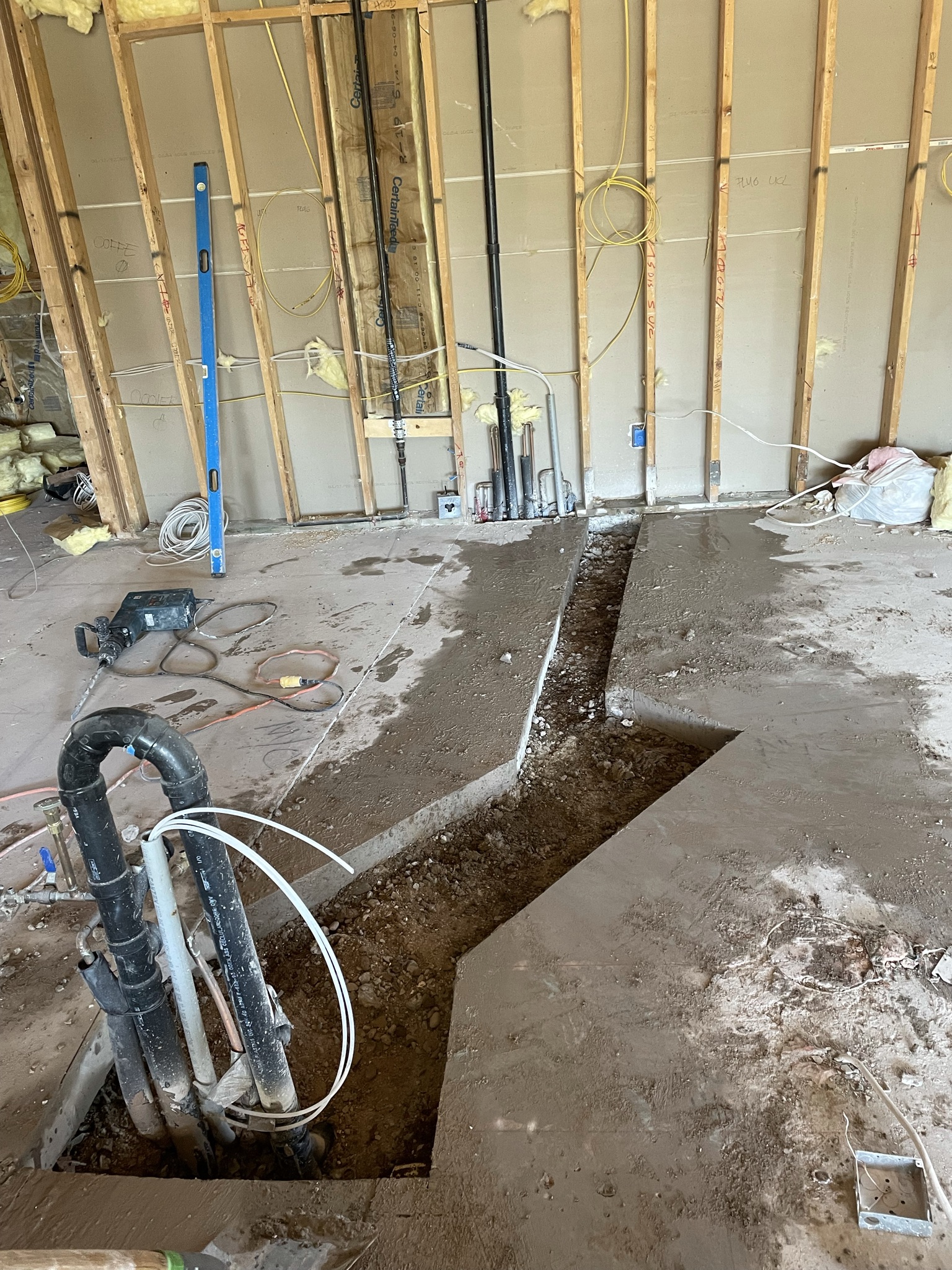 Cutting channel in concrete for new kitchen.